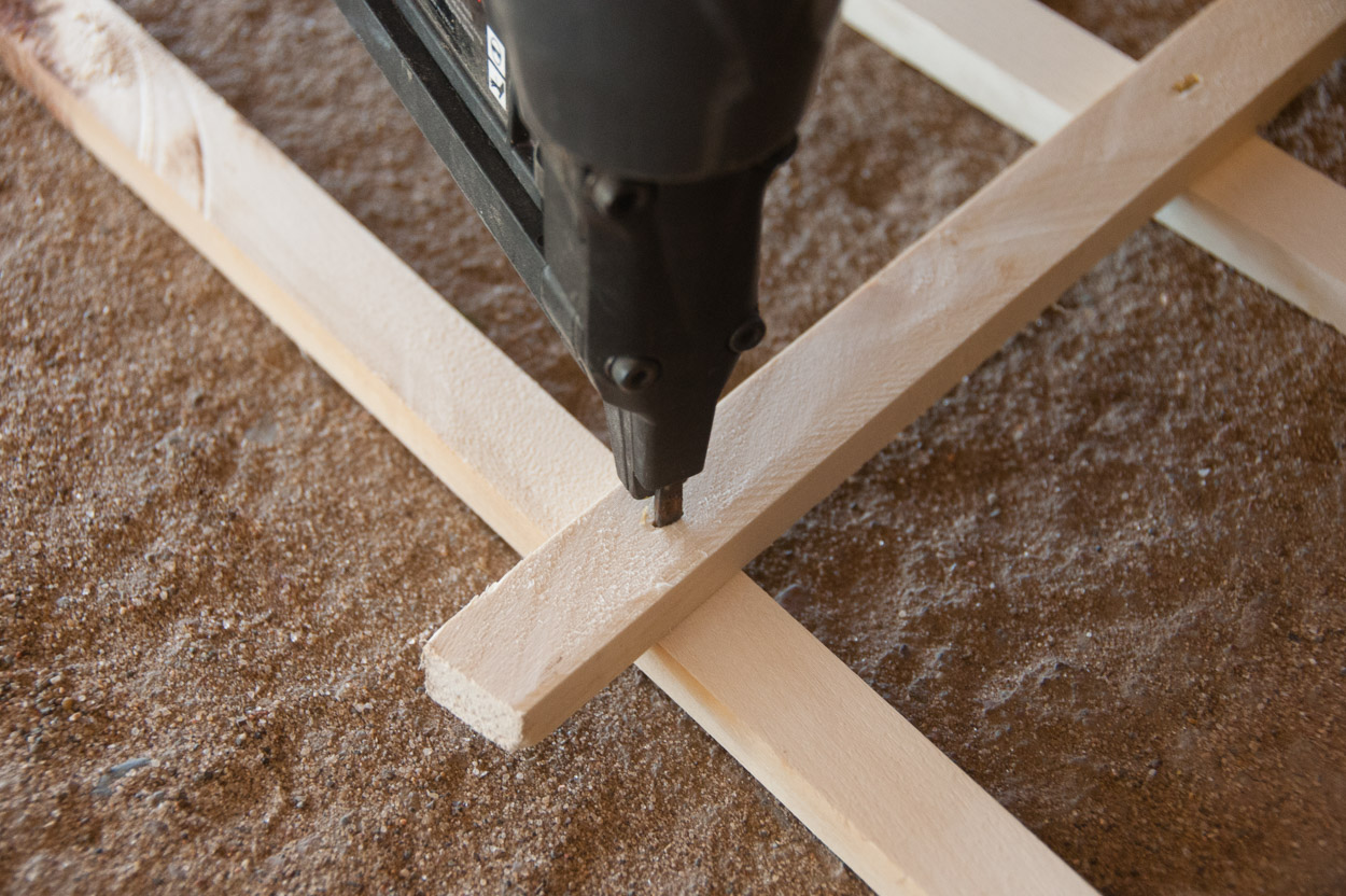 Nail gun pinning the wooden junctions into place.